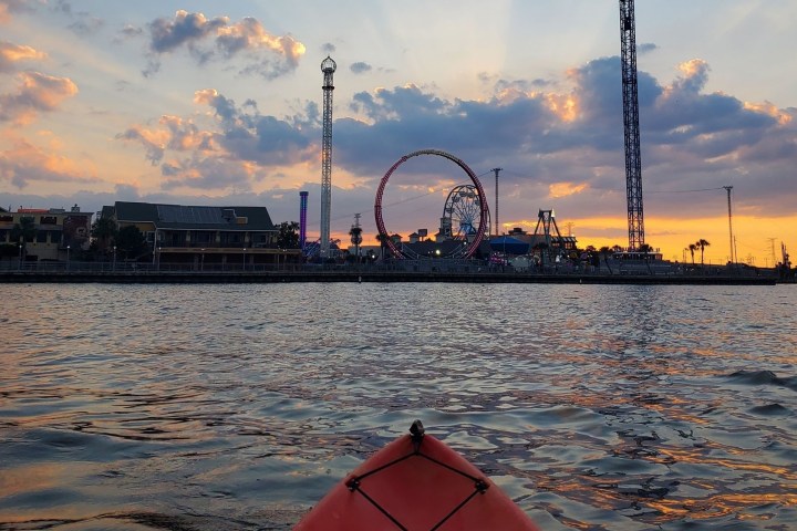 a boat is docked next to a body of water