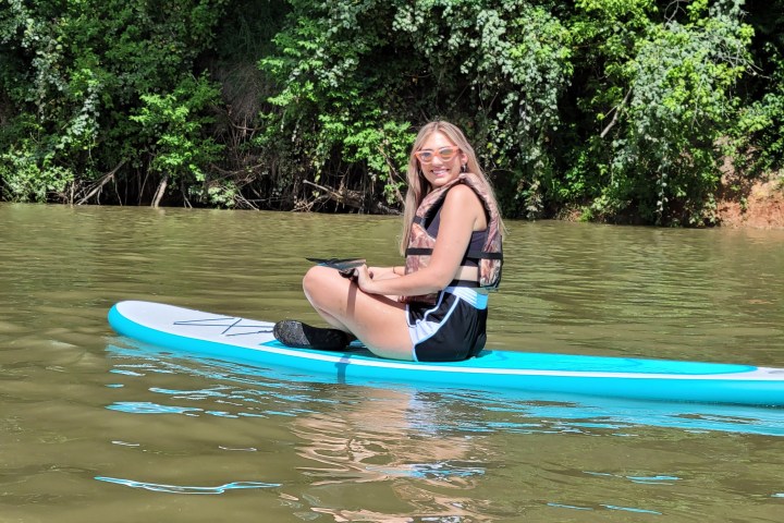 a person riding a surfboard in the water